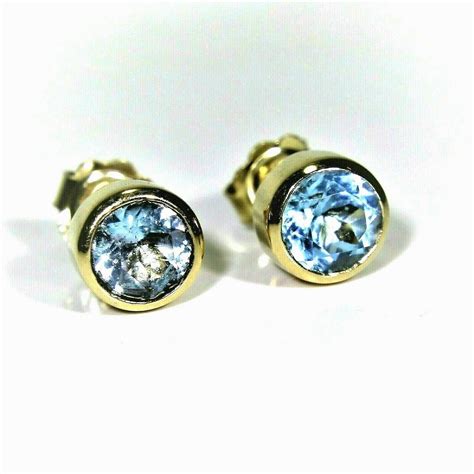 14k gold topaz earrings.